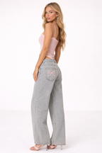 Spodnie dżinsowe z szerokimi nogawkami i detalem w postaci kokardy